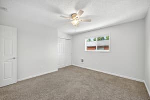 Bedroom with carpeted floor, ceiling fan at Lincoln Court Townhomes, 230 Lincoln Street, Fairview, Oregon 97024