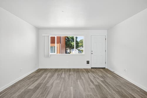 3 Bedroom townhome living room with large window at Lincoln Court Townhomes