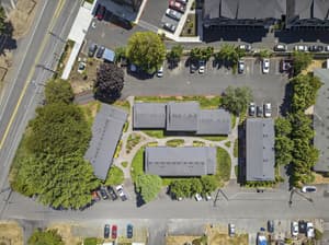Aerial with multiple buildings, parking lots at Lincoln Court Townhomes, 230 Lincoln Street, Fairview, Oregon 97024