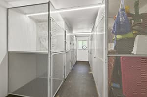Storage with metal cages, concrete floor at Lincoln Court Townhomes, 230 Lincoln Street, Fairview, Oregon 97024