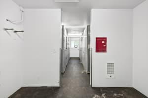 Storage with metal lockers, concrete floor at Lincoln Court Townhomes, 230 Lincoln Street, Fairview, Oregon 97024